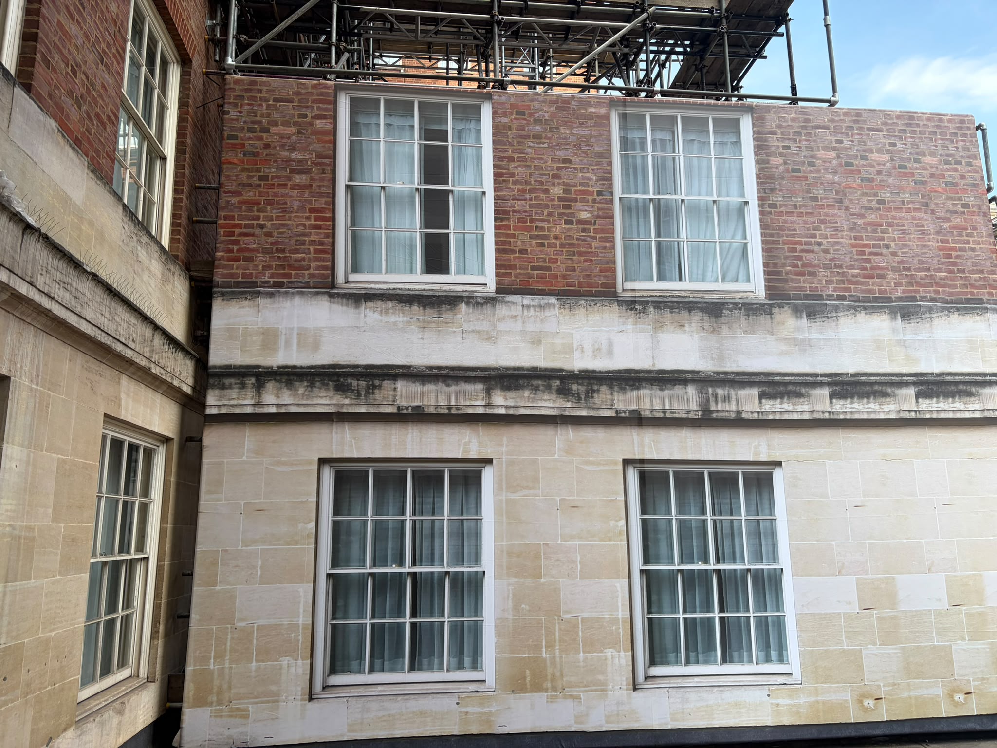 Scaffold wrap with printed stone work